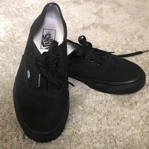 Black Vans.